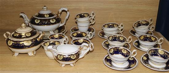 A Ridgway blue, gilt and cream decorated part tea service